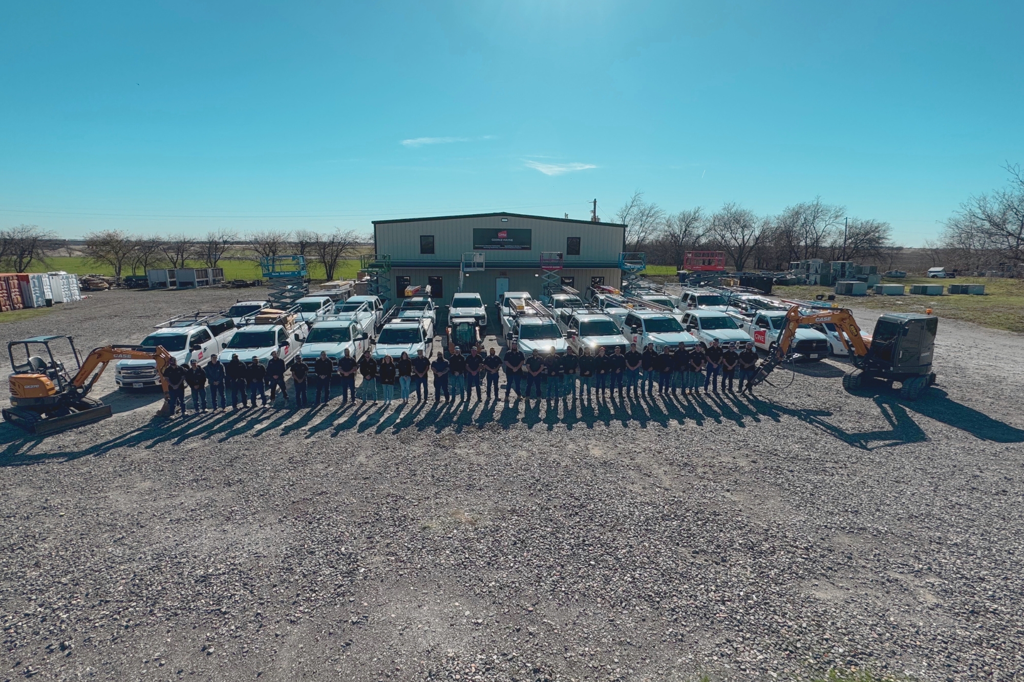 George Wayne Mechanical full team lineup with company fleet of service trucks